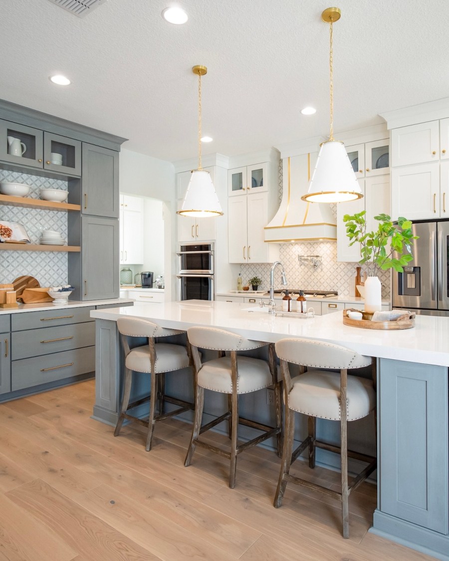 Kitchen with blue cabinets and white countertops